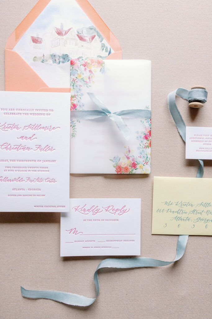 Printed vellum wrapped custom wedding invitation with silk ribbon