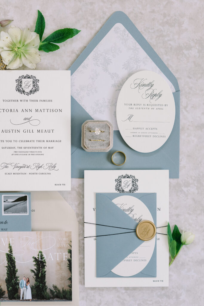 Elegant letterpress wedding invitation featuring die cut reply card and envelope liner