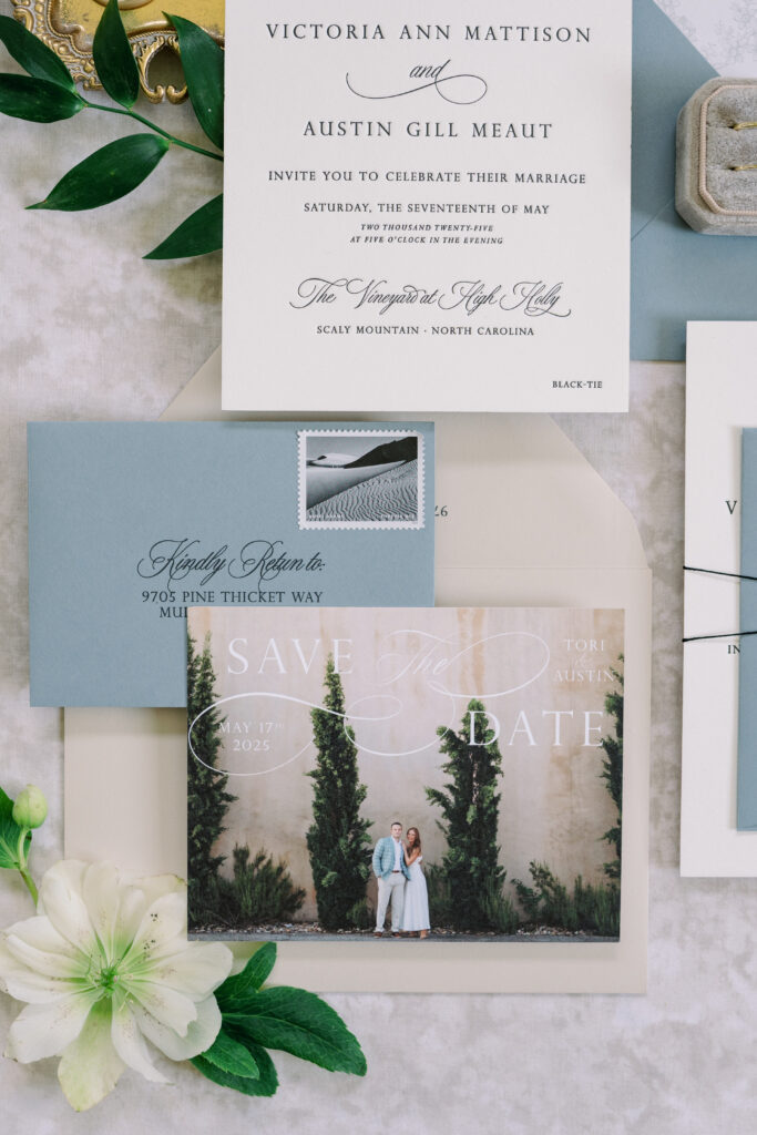 Engagement photo save-the-date at Georgia winery and dusty blue envelope