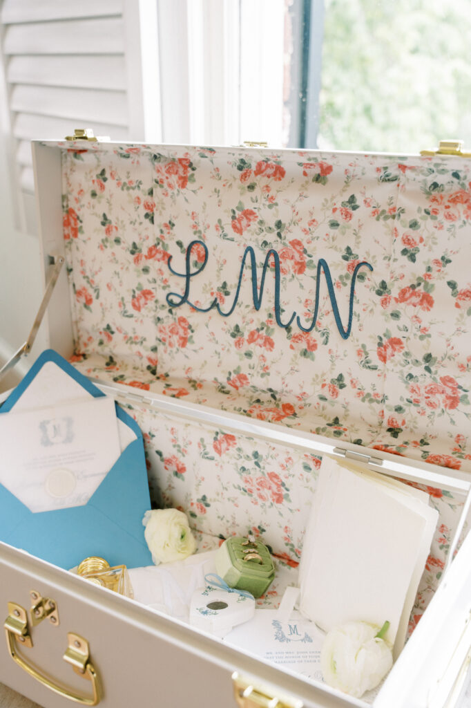 Crest and monogram wedding invitation with vellum overlay