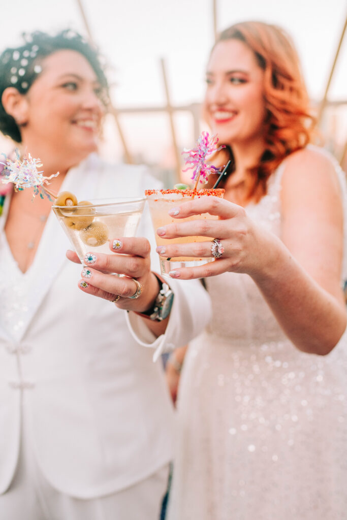 joyful ceremony moment for two brides at vibrant Ventanas wedding