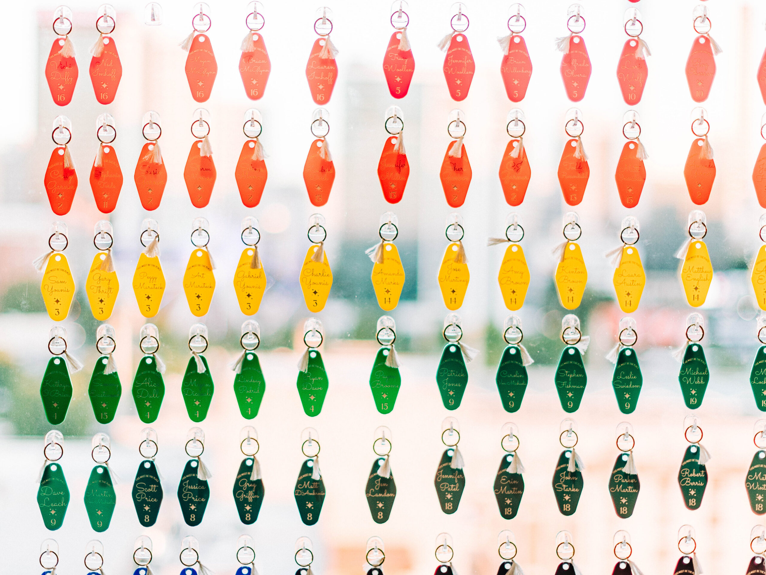 Rainbow retro motel keychains as escort cards